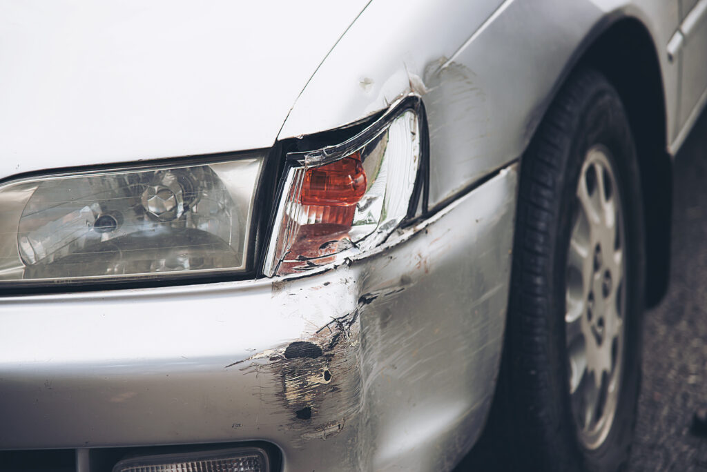 car damage on road accident car insurance concept